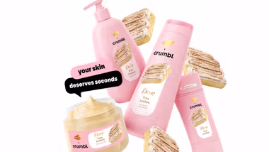 Products from the Dove x Crumbl Tres Leches limited edition range in vibrant pink packaging.